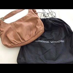 🤎🧡Soft leather shoulder bag with brushed golden tone hardware & ruffle detail.